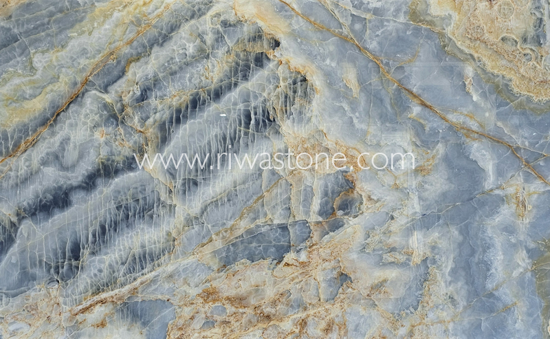 Blue Ocean Onyx natural slab with translucent blue crystals, ivory formations and golden mineral veins from Iran.