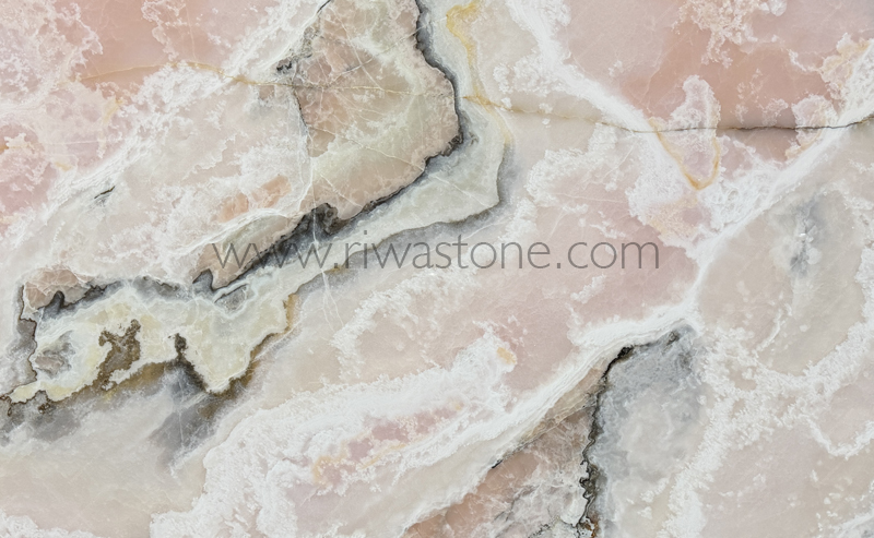 Natural Pink Onyx slab featuring soft blush pink, ivory crystalline formations and subtle grey mineral veins from Iran.