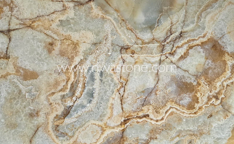 Sunset Onyx natural slab featuring translucent grey-green crystals with warm golden mineral veins from Iran.