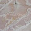 Pink Onyx slab featuring soft blush pink tones, flowing white crystalline veins and natural translucent beauty from Iran.